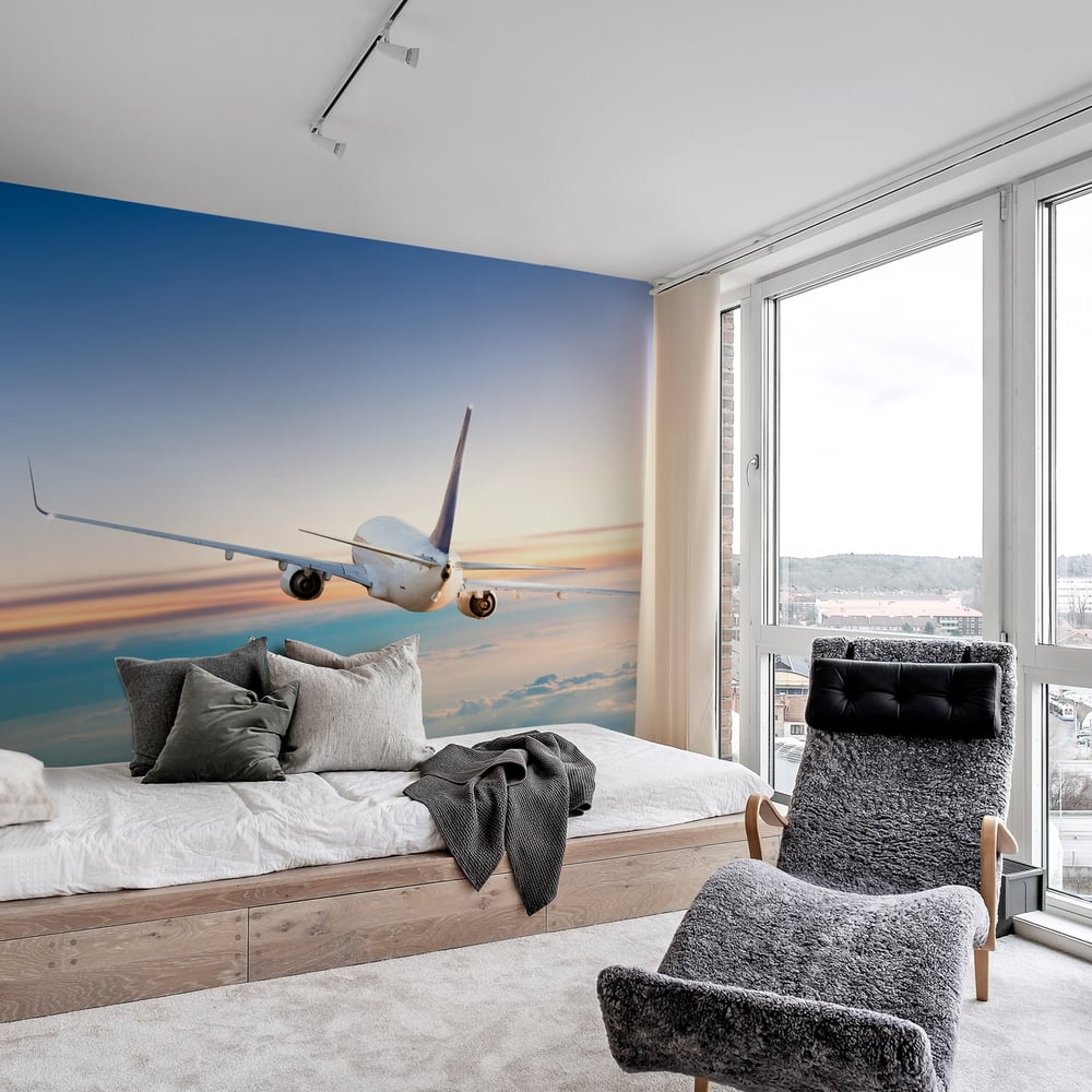 Wall Mural - Airplane flying above clouds - Scandiwall