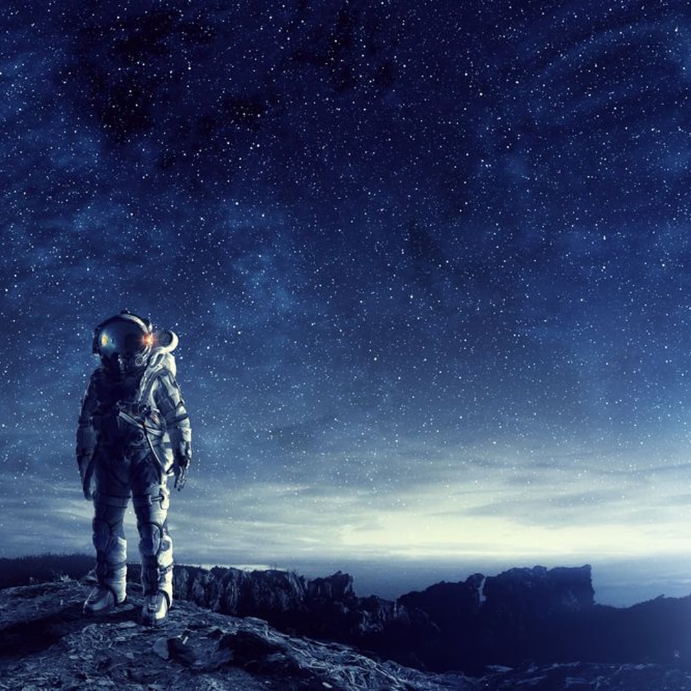 Fototapet - Astronaut in outer space Mixed media - Photo Wallpaper Astronomy and Space